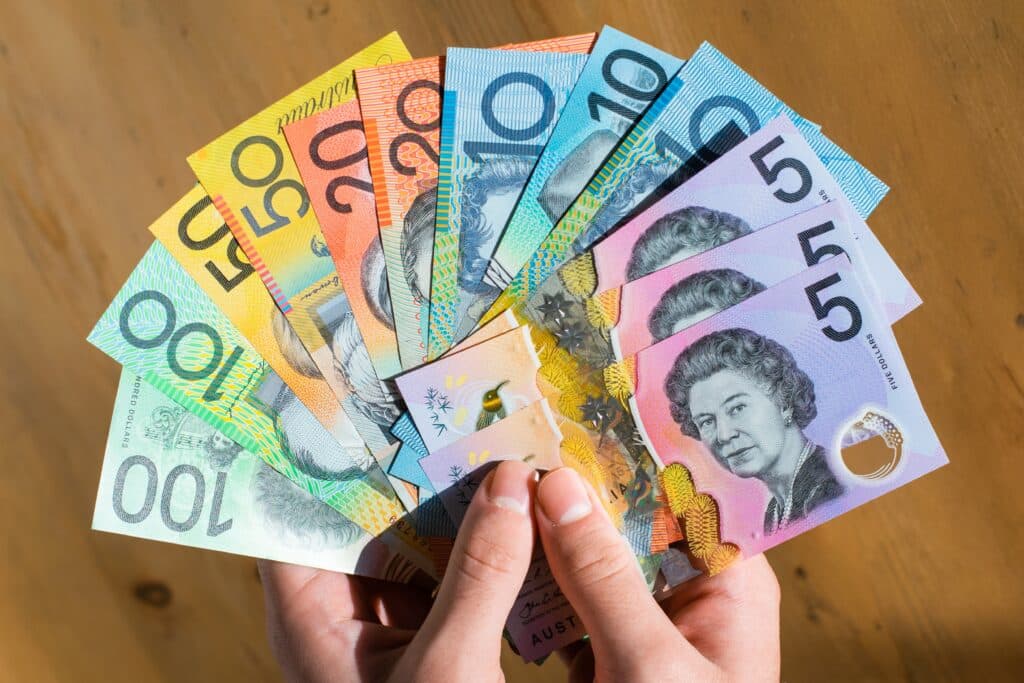 Australian currency the Australian dollar displayed in a hand in a list of most beautiful currencies